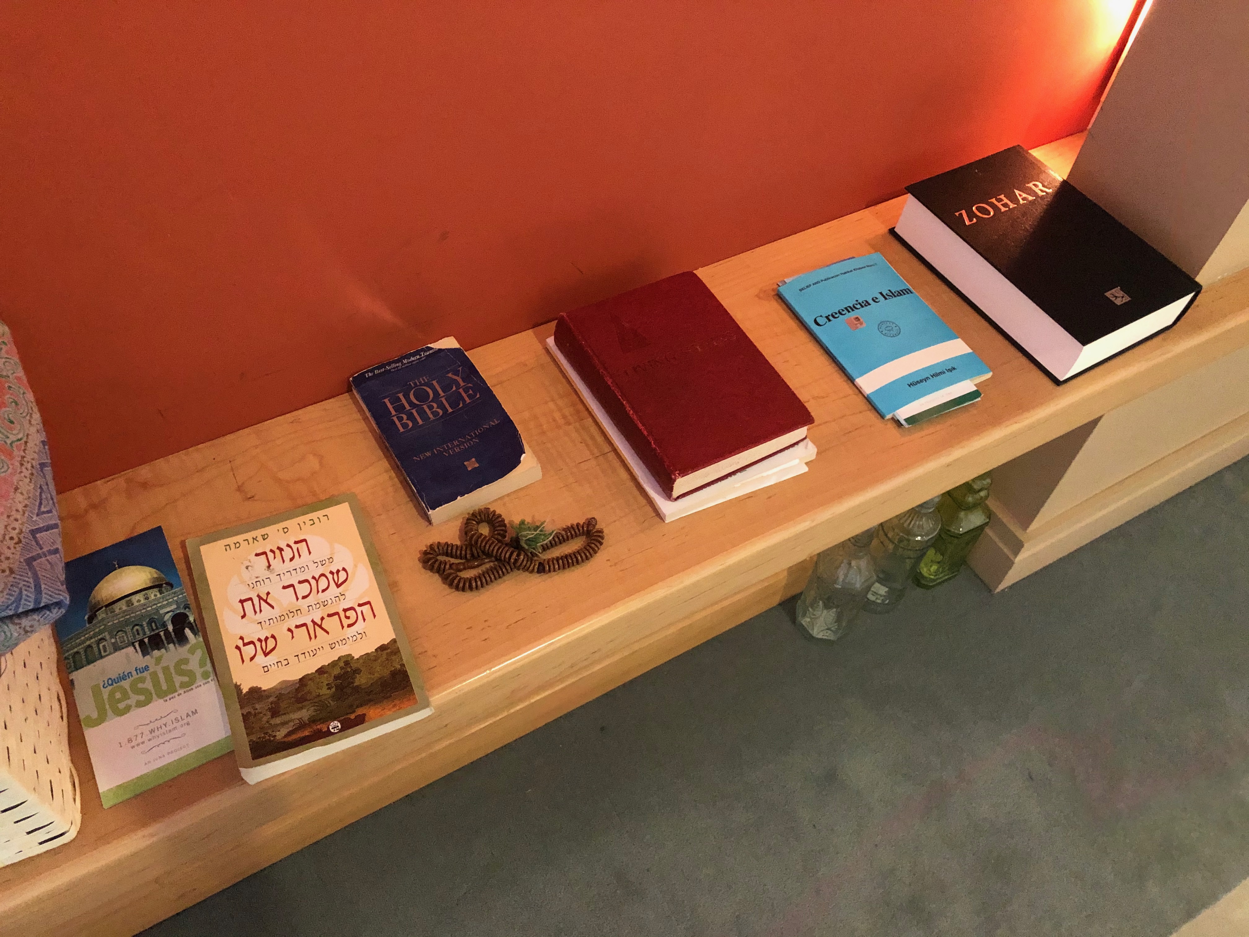 a wooden bench with prayer books