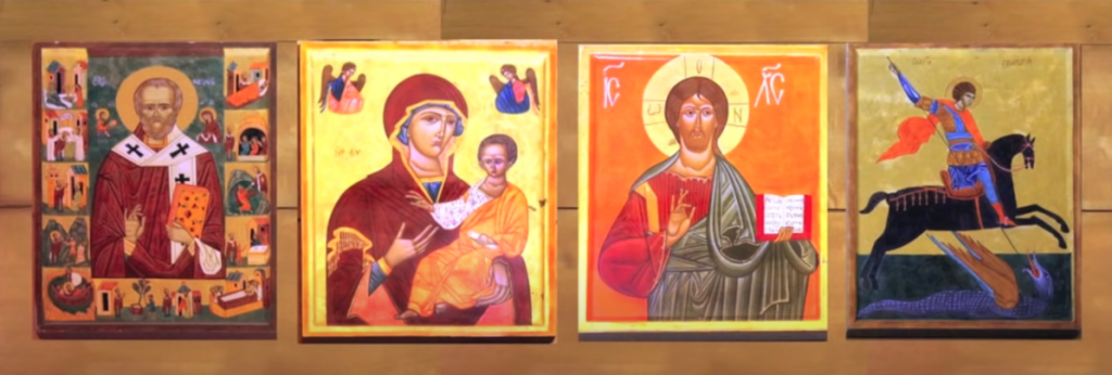 bright yellow and orange portraits of four saints
